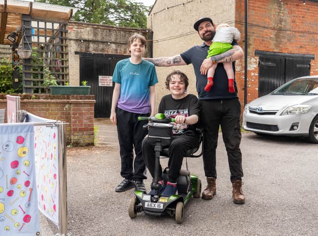 Alex with his dad Shaun and brothers.