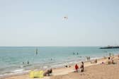 People enjoying the sunshine at Southsea seafront.