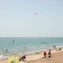 People enjoying the sunshine at Southsea seafront.