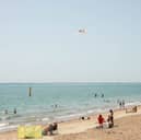 People enjoying the sunshine at Southsea seafront.