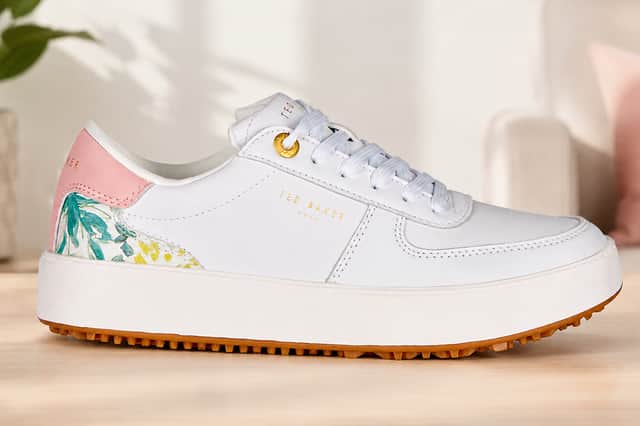 Ted Baker Ladies Swagger Waterproof Spikeless Golf Shoes combine a clean white design with subtle floral detailing, offering a stylish option for golfers who want comfort on and off the course.