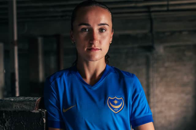 Pompey Women skipper Jazz Bull models the new home kit for the 2026-27 season.