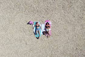 Hot Weather in Southsea 
Pictured: Helen Hills and Franchesca Bradbeer enjoying the sun on Southsea  beach
Picture: Habibur Rahman