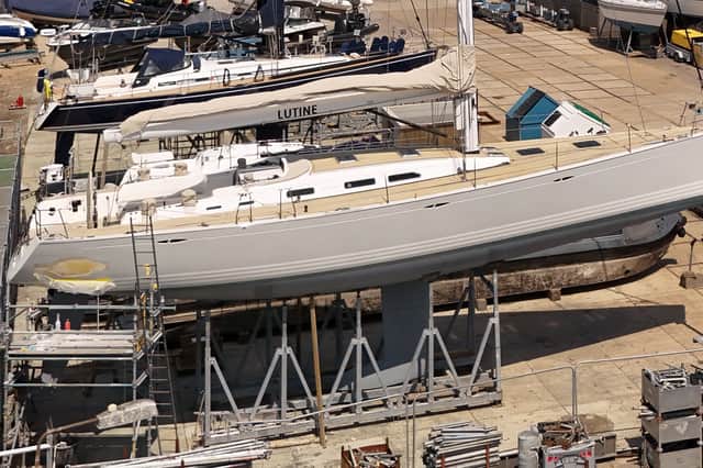 A sailing yacht is being kept in an off-limits area of a marina for repairs after a Royal Navy unmanned drone ship crashed into her.