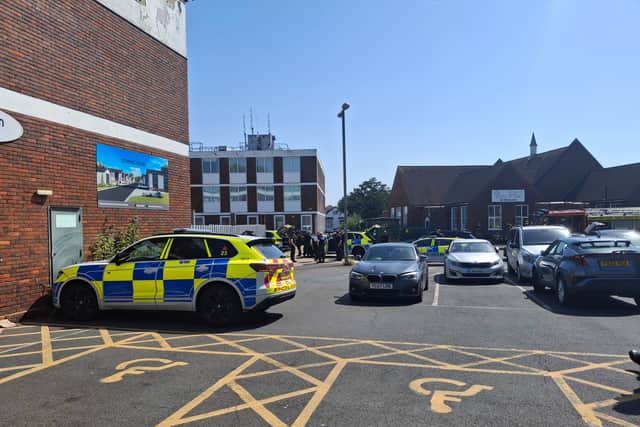 Armed police and fire crews have been deployed to Portchester Precinct, with part of the area "sealed off" from the public.
