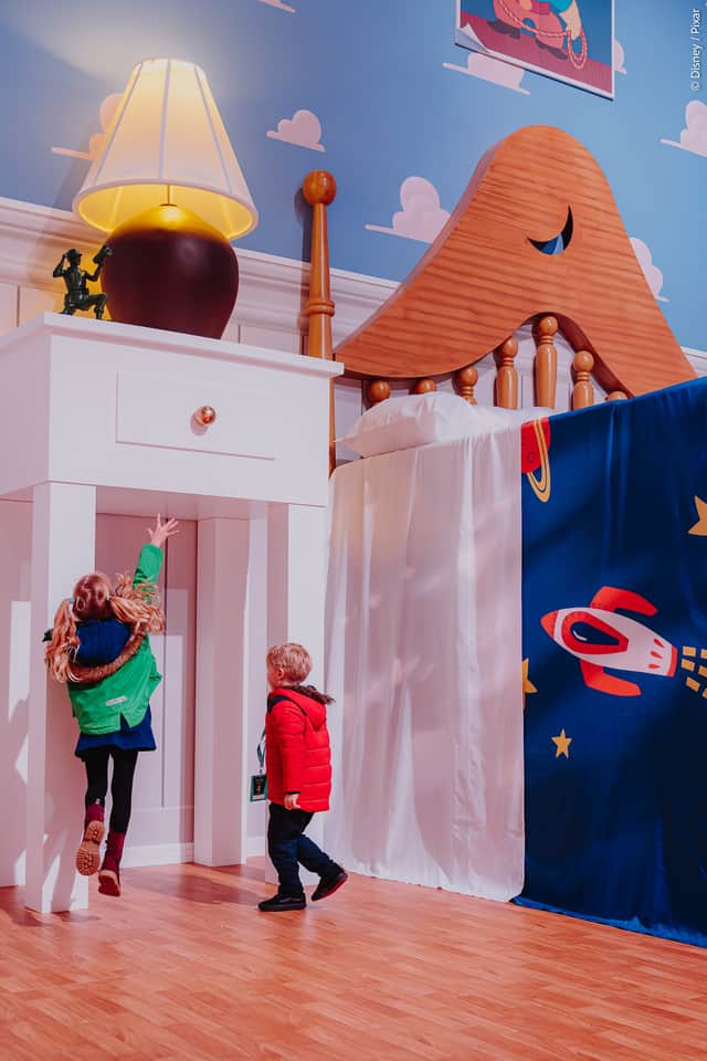 It's playtime! Visitors shrink to the size of Woody and Buzz as they explore Andy's bedroom at Mundo Pixar - London.