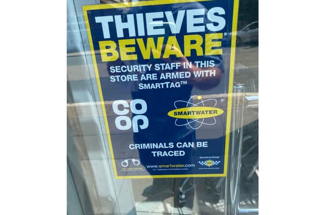 A “thieves beware” sign in the window of 251 Albert Road Co-op that seems to have little deterrent  