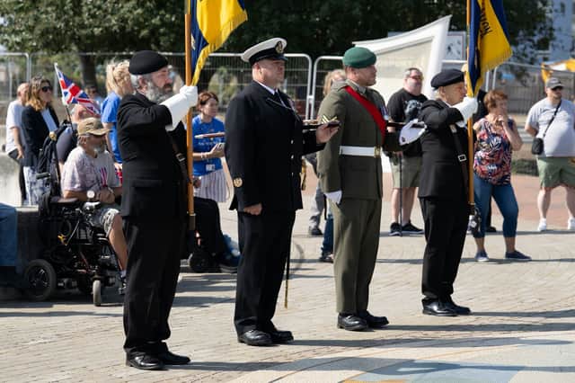 Local veterans join HMS Sultan personnel at the Armed Forces Week flag raising in Gosport, bridging past and present service.