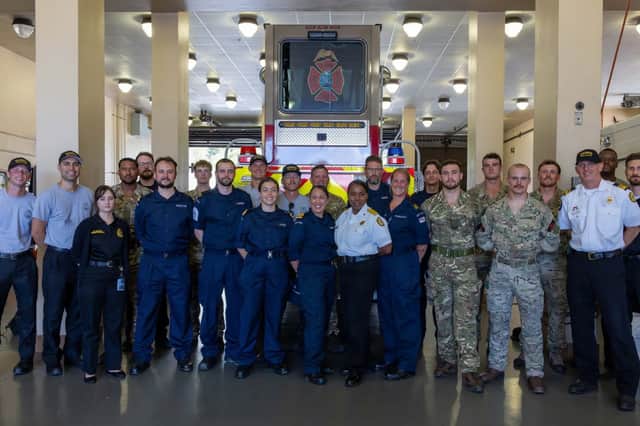 Tampa firefighters with HMS Trent personnel in Fire Station.
