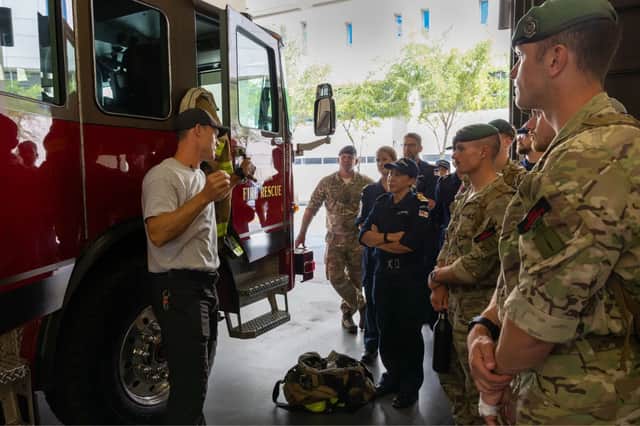 Personnel from HMS Trent are briefed in Tampa's Fire Rescue HQ The Big House