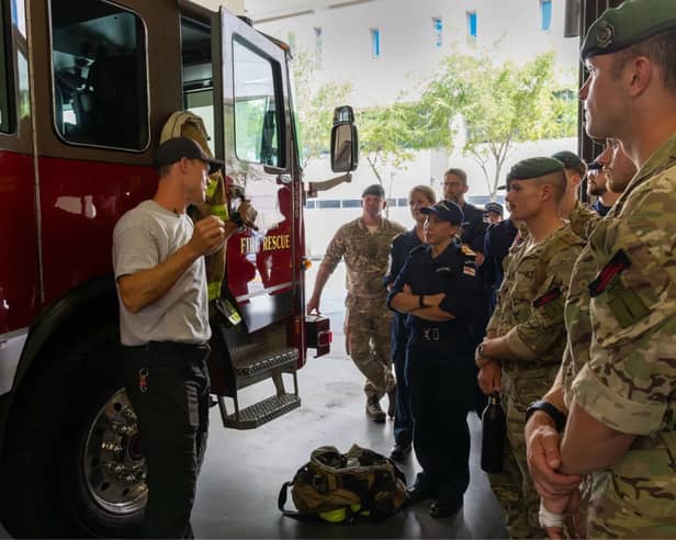 Personnel from HMS Trent are briefed in Tampa's Fire Rescue HQ The Big House
