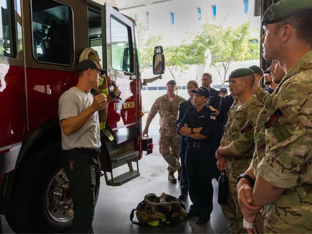 Personnel from HMS Trent are briefed in Tampa's Fire Rescue HQ The Big House