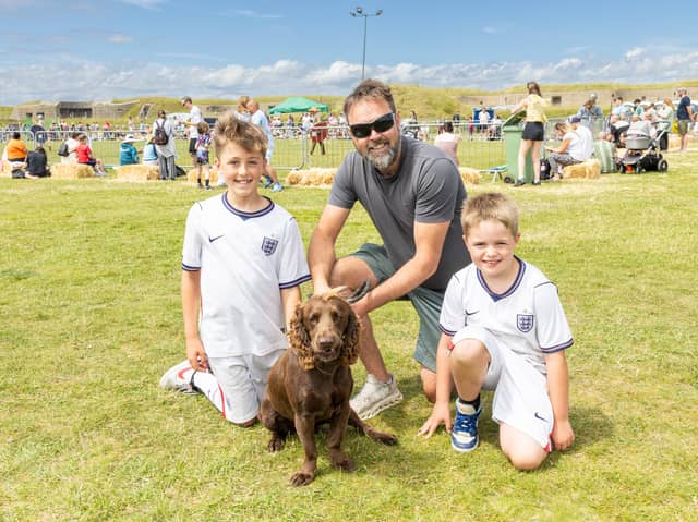 Pictured: (from left) Oliver, Damien - dad, Harry Jarvis and cocker spaniel