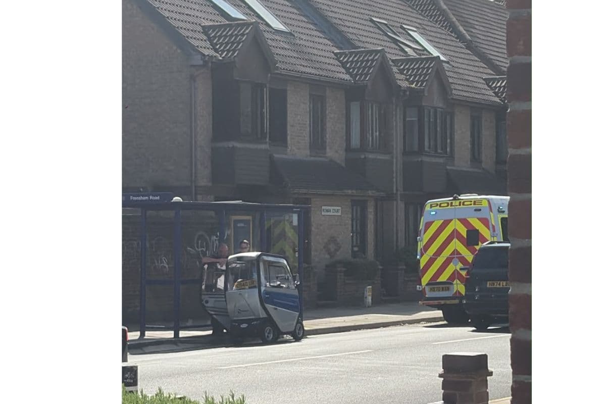 Disabled person on mobility scooter pulled over by police van on busy ...
