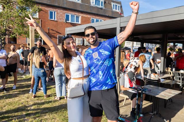 Mikey Denham, 35, of Horndean, celebrating England's victory against DR Congo alongside his wife at The Green Posts in Hilsea.