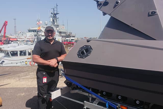 Kraken chief marketing officer Ed Tilston alongside the K3 Scout.