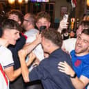 England fans rejoice after Harry Kane scores his second half penalty.