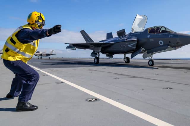 An F-35B fighter prepares to take off from HMS Prince of Wales to intercept a Russian Tupolev Tu-142 maritime reconnaissance and anti-submarine warfare (ASW) aircraft, NATO name 'Bear'.