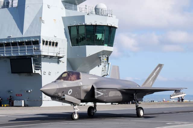 An F-35B fighter prepares to take off from from HMS Prince of Wales to intercept a Russian Tupolev Tu-142 maritime reconnaissance and anti-submarine warfare (ASW) aircraft, NATO name 'Bear'.