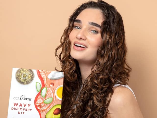 The Curlsmith Discovery Kit includes four premium curl care products designed to cleanse, moisturise, style and refresh curly hair. Photo posed by model.
