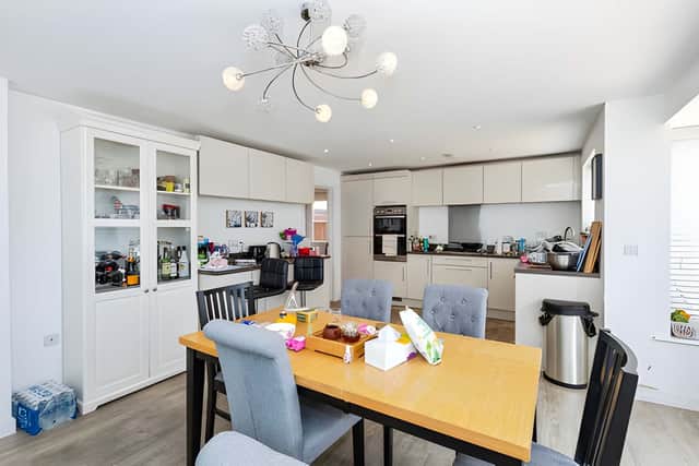 The modern kitchen-dining area creates a practical and sociable heart to everyday family life