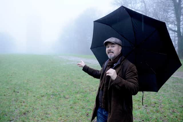 Weird Britain presenter Andy Mcgrath at the King Alfred tower on a misty day