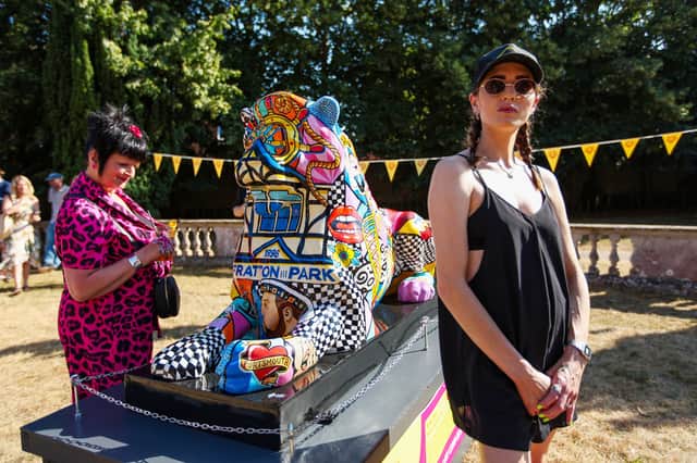 Artist Daisy Barker, right, with her lion, Cushty