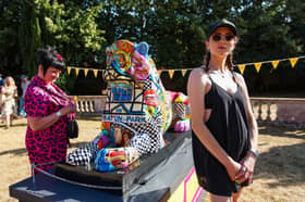 Artist Daisy Barker, right, with her lion, Cushty