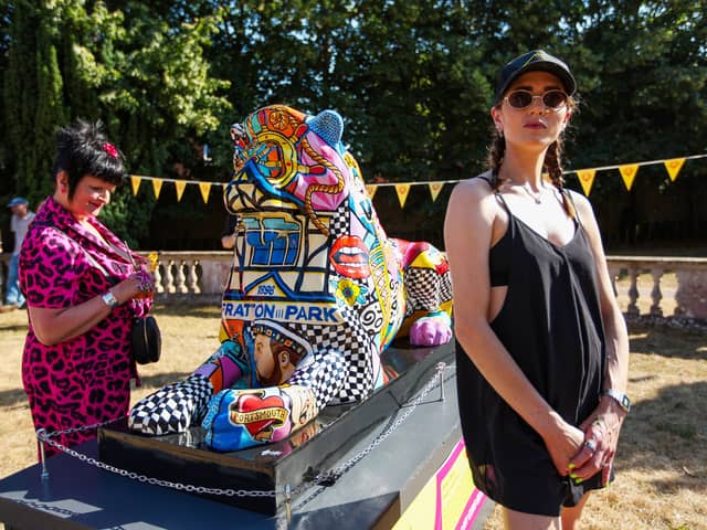 Artist Daisy Barker, right, with her lion, Cushty