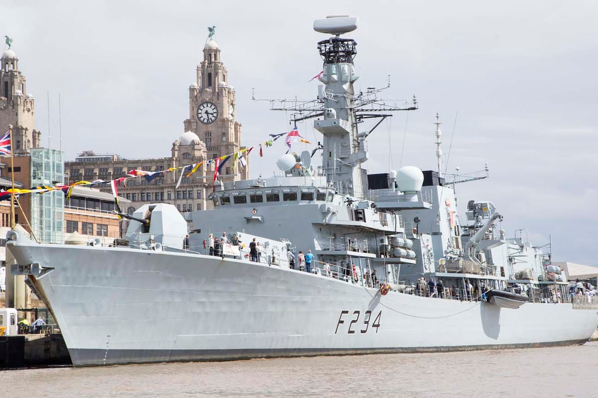Decommissioned Royal Navy ship HMS Iron Duke being towed to Portsmouth after being stripped of weapons - when