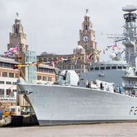 Decommissioned Royal Navy ship HMS Iron Duke being towed to Portsmouth after being stripped of weapons - when