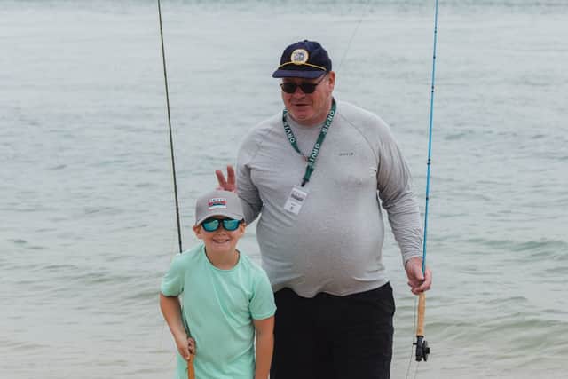 Shane Davies, right, founder of Angling Mentors, has left work to focus full-time on teaching youngsters how to fish.