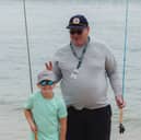 Shane Davies, right, founder of Angling Mentors, has left work to focus full-time on teaching youngsters how to fish.