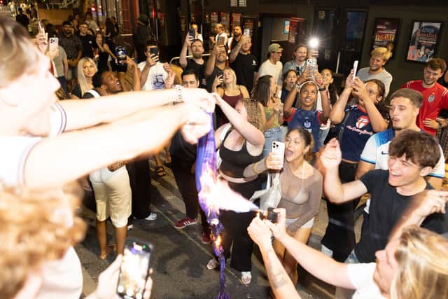 England fans set fire to an Argentina shirt in Portsmouth.