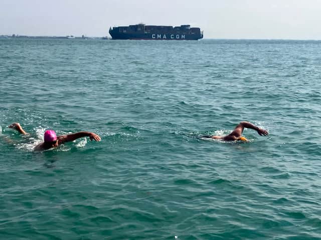 Mark Ryan and Simon Harmer swimming across the Solent. Simon is the first double amputee to take on the challenge.