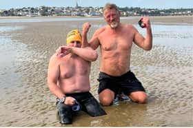 Simon Harmer and Mark Ryan on Ryde beach after swimming the Solent.