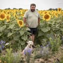 Sam' Sunflower field is due to open on the weekend of 25th July 2026
Pictured:Owner Sam Wilson and his dog Piper 
Picture: Habibur Rahman
