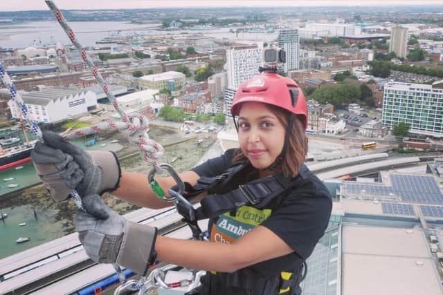 Brave fundraisers are being invited to step over the edge and take on an unforgettable challenge in support of South Central Ambulance Charity at the iconic Spinnaker Tower in Portsmouth on Saturday, 12 September 2026.
Pictured: Nikhyta Patel, learning disability specialist at SCAS who completed the Spinnaker Tower Abseil Challenge in 2021 for the South Central Ambulance Charity.