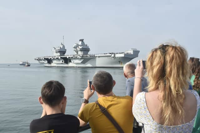 HMS Prince of Wales returned home to HMNB Portsmouth on July 24, 2026, after completing the first phase of Operation Firecrest. Families and friends gathered along the Hot Walls and on The Round Tower in Old Portsmouth to welcome the sailors back to base.
