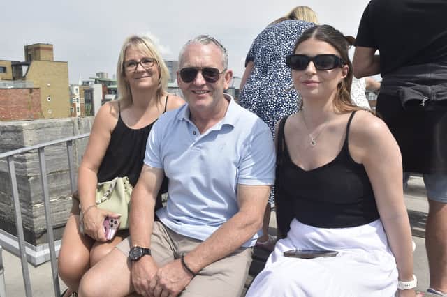 Pictured is: (l-r) Amanda and John Mould with Ella Hudson, waiting to see 25-year-old George Mould aboard HMS Duncan. All have travelled from Salisbury.
