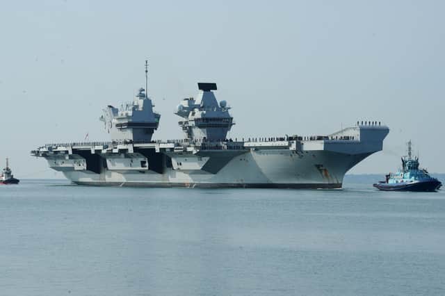 HMS Prince of Wales sailing towards HMNB Portsmouth.