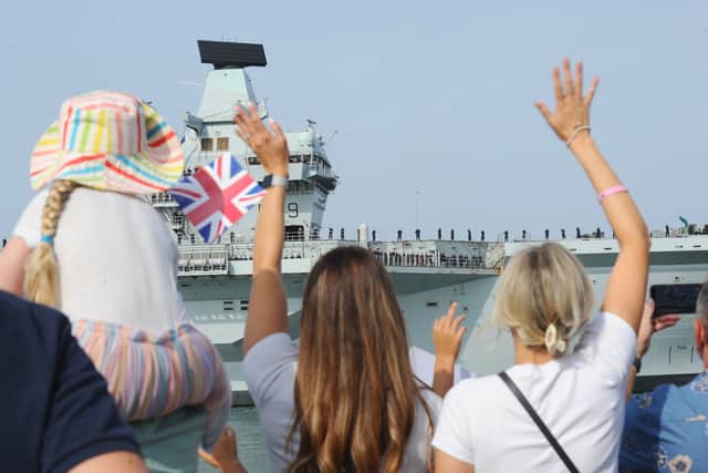 HMS Prince of Wales returning home to Portsmouth on Friday, July 24, 2026, after completing the first phase of Operation Firecrest. Families and friends gathered at the Hot Walls and the Round Tower in Old Portsmouth to welcome her home.