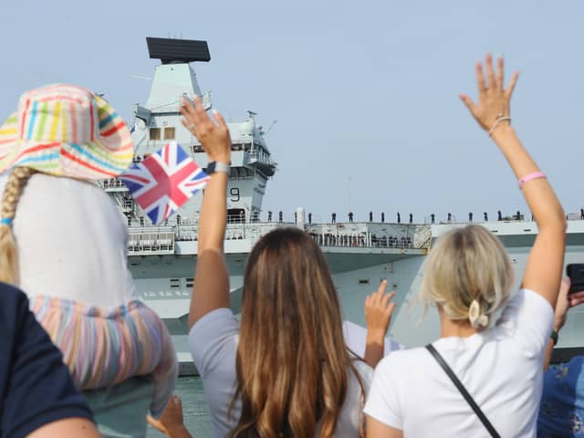 HMS Prince of Wales returning home to Portsmouth on Friday, July 24, 2026, after completing the first phase of Operation Firecrest. Families and friends gathered at the Hot Walls and the Round Tower in Old Portsmouth to welcome her home.