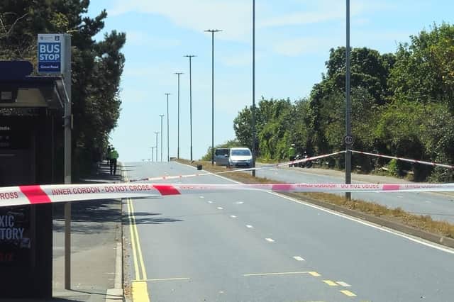 An area around the Grove Road bus stop has been taped off from the public.