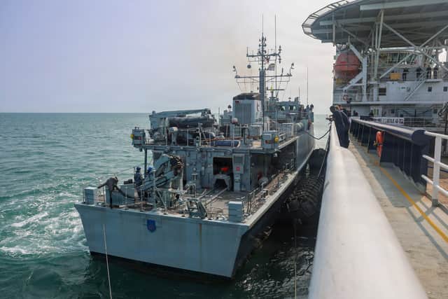Royal Navy mine countermeasures support vessel HMS Stirling Castle (M01) conducts a replenishment-at-sea evolution with Ukrainian Navy ship Sandown-class minehunter UNS Chernihiv (M310) in Weymouth Bay during Sea Breeze 26-2 July 21,