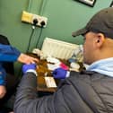 Clive Williams from The Hepatitis C Trust testing a patient for the virus 