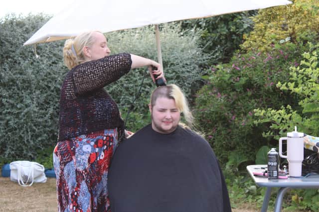 Katie's friend Ash shaved their head too to help raise money
