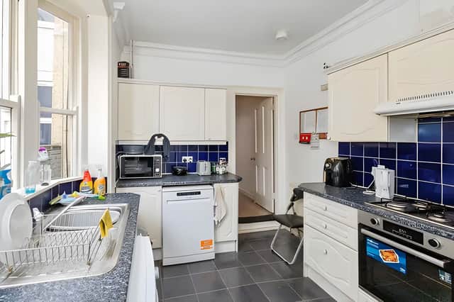 The fitted kitchen comes equipped with a built-in oven, hob and extractor for everyday convenience.