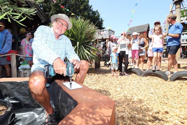 Dave Potter planted an olive tree with a plaque commemorating the 50 year anniversary