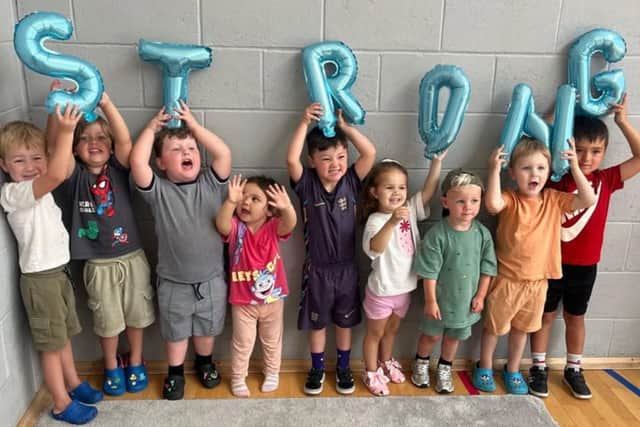 Children from The Play Corner Hillside, Wymering, celebrate a 'strong' Ofsted inspection.